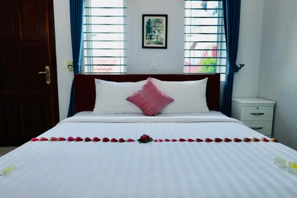 Cozy bedroom at our Siem Reap guesthouse, Carolina Angkor Villa